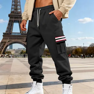 Close-up detail of men's black fleece cargo sweatpants featuring striped pocket accent