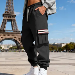 Close-up detail of men's black fleece cargo pants with a striped utility pocket flap