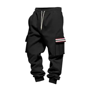 Detail view of black fleece cargo jogger pants for men with striped pocket design