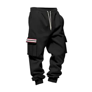 Detail view of black fleece cargo pants with striped pocket flaps and ribbed cuffs