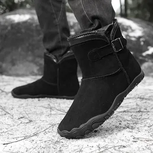 Stylish women's black suede snow boots with warm fur lining and non-slip flat rubber sole
