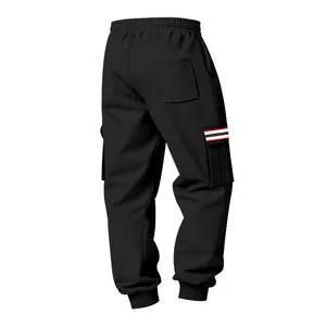 Detailed view of black fleece cargo pants with striped pocket flap and ribbed cuffs.