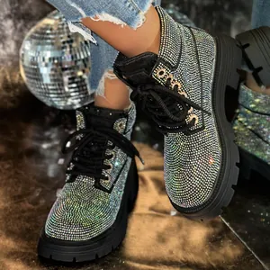 Close-up detail of luxury iridescent rhinestone-encrusted Martin boots for women.