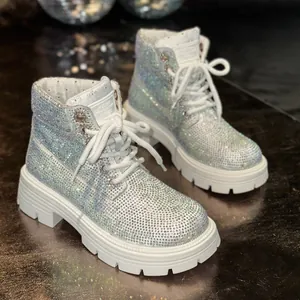 Close-up detail of luxury sparkling rhinestone Martin boots with white thick soles