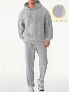 Close-up detail of grey cable-knit jacquard texture on men's hooded tracksuit set