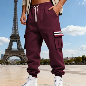 Detailed view of men's fleece-lined burgundy cargo sweatpants with striped pocket detail