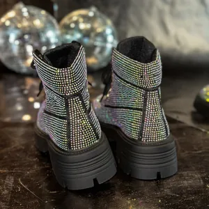 Shimmering iridescent rhinestone Martin boots with thick platform sole from back view.