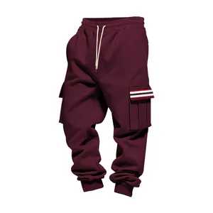 Detailed view of men's burgundy fleece cargo pants featuring a unique striped pocket detail