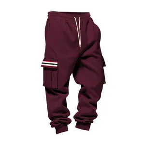 Detail view of men's burgundy fleece cargo sweatpants featuring striped pocket flaps