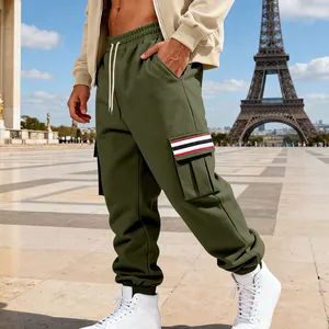 Close-up of men's olive green fleece cargo pants with striped pocket and drawstring
