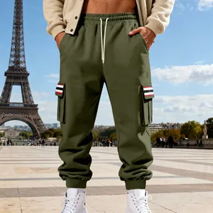Detail view of men's fleece cargo sweatpants with striped pocket flaps and elastic cuffs