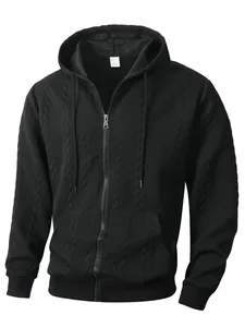 Detailed shot of black men's zip-up hoodie featuring a unique jacquard knit pattern
