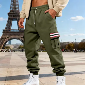 Detailed view of olive green fleece cargo sweatpants with striped pocket accent