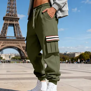 Close-up of olive green cargo joggers featuring a distinctive striped side pocket design