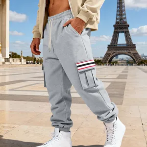 Men's grey fleece cargo sweatpants with red striped pocket detail and jogger fit