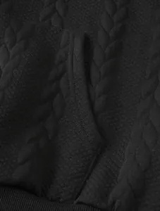 Close-up view of the premium black cable-knit jacquard texture on this men's casual hoodie.