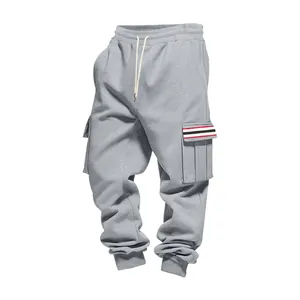 Detailed macro view of mens grey fleece cargo sweatpants with multi-pocket design