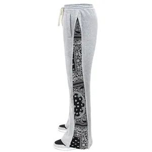Detailed side view of grey men's hip-hop pants with paisley pattern snap button panels