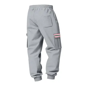 Back view of grey men's fleece cargo sweatpants with multi-pockets and striped detail