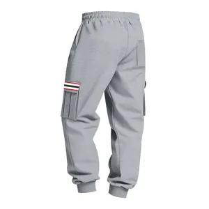 Detailed rear view of grey men's cargo joggers featuring a striped pocket accent