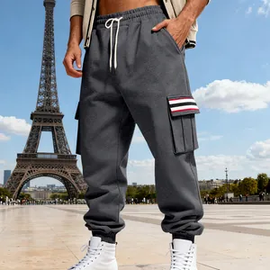 Detailed look at men's dark gray fleece cargo pants with unique striped pocket accents