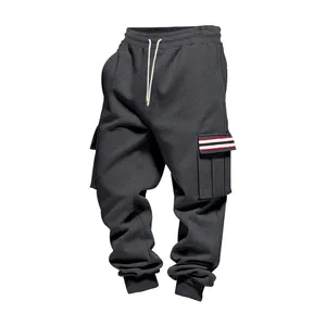 Detailed view of men's fleece cargo joggers with multi-pocket and striped flap