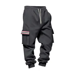 Detail of grey fleece cargo pants featuring striped accents and large side pockets.