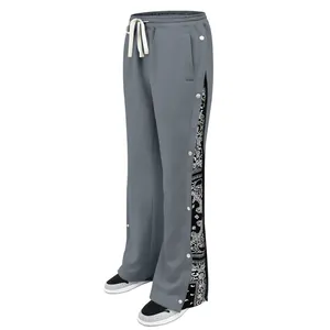 Detail of grey hip-hop streetwear pants with side snap buttons and bandana panel