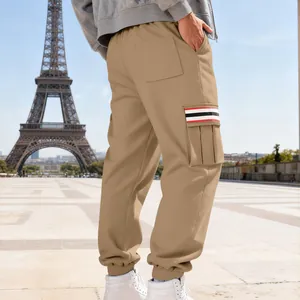 Close-up view of khaki fleece-lined cargo pants with striped side pocket detail