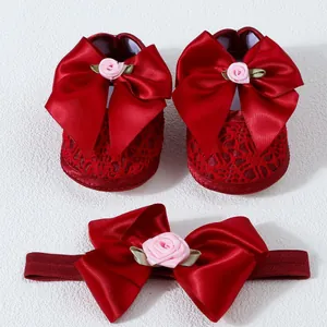 Elegant red lace baby girl shoes and matching headband set with large satin bow and rose