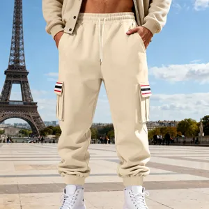 Detailed view of beige men's fleece cargo joggers with a stylish multi-pocket design