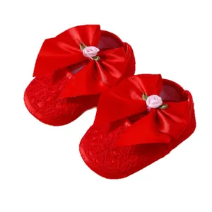 Red lace baby princess shoes with large satin bow and rose detail for 0-1 year olds