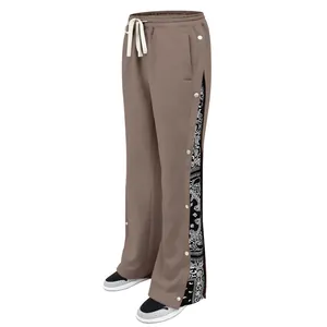 Side view of heavyweight brown casual pants with row buttons and paisley pattern details
