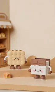Detailed view of cartoon biscuit and chocolate pen holders for cute desk organization.