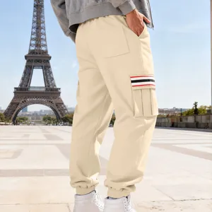 Detailed back view of men's beige fleece joggers featuring a unique striped cargo pocket