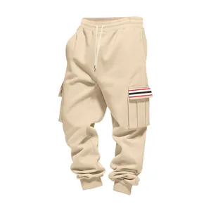 Detail of beige men's fleece cargo pants with striped pocket and drawstring