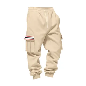 Close-up detail of men's beige fleece cargo sweatpants with striped pocket flap decoration