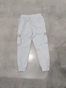 Back view of men's grey fleece cargo joggers with striped multi-pocket details.