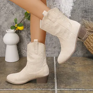 Side view of vintage beige embroidered cowboy boots for women with V-mouth and chunky heel