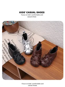Detailed view of stylish kids' leather ankle boots with bow accents in various colors.