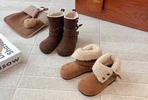 Detail of kids winter boots with warm faux fur lining and fold-over design.