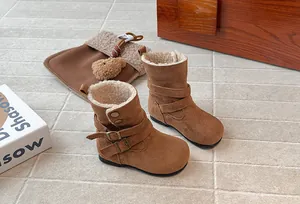 Close-up of brown Maillard style girl's winter boots featuring warm plush fleece lining