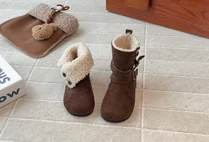 Close-up detail of retro brown girls winter boots with warm foldable fleece lining