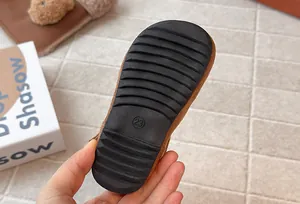 Detailed macro view of durable black rubber non-slip sole for girl's stylish winter boots
