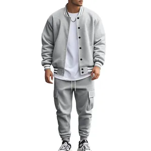Detailed view of men's grey fleece varsity jacket and cargo pants tracksuit set