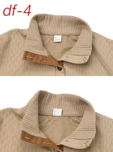 Detailed view of men's khaki jacquard sweatshirt showing stand collar and care labels