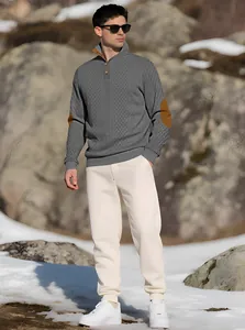 Detail view of men's gray high neck knitted sweater with stylish elbow patches.