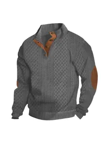 Detailed texture of grey cable-knit men's sweater with brown elbow patches