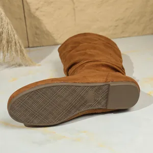 Detail showing the non-slip rubber sole and size 37 mark on a brown suede boot