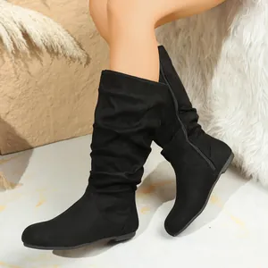 Women's black suede slouchy mid-calf boots with round toe and side zipper detail.